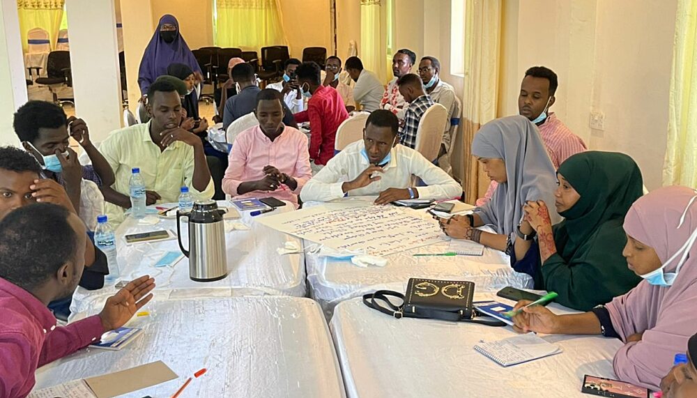 Representatives from Beledweyne's society eagerly discussing the community-owned Climate Security Action Plan during our verification forums in Beledweyne.